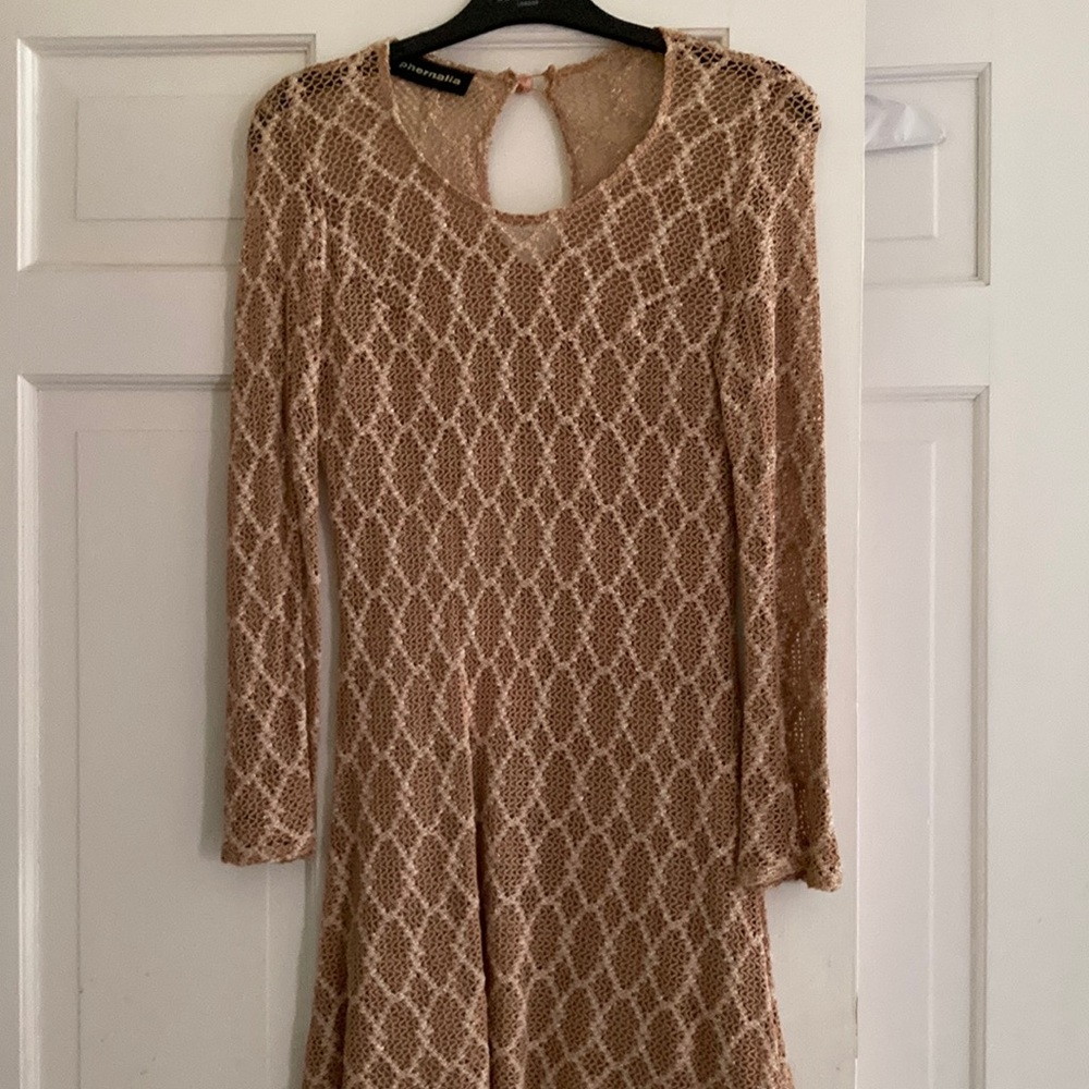 Crochet Look beige dress with a slight swing.